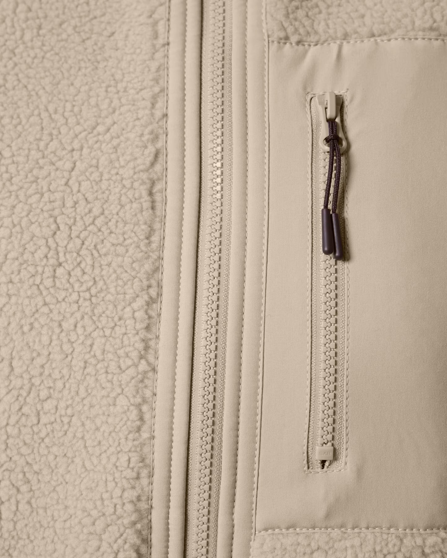 Troelty Sherpaweste Beige Fronttasche mit Reißverschluss